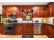 Kitchen with stainless steel appliances, wood cabinets and granite countertops at 4111 Mcclatchey Ne Cir, Atlanta, GA 30342