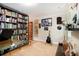 The home office features a bookshelf, a guitar, and a window for natural light, creating a comfortable work environment at 4111 Mcclatchey Ne Cir, Atlanta, GA 30342