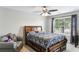 Cozy bedroom featuring a large bed, stylish decor, and natural light from a window at 461 Silver St, Buford, GA 30518