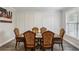 Dining room featuring a large table with decorative chairs and natural light at 461 Silver St, Buford, GA 30518