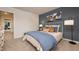Bedroom with decor, comfortable bed, and an open doorway to a living space at 4946 Jatoba Rd, Acworth, GA 30101