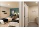 Shared bedroom with two twin beds and an open view into the laundry room at 4946 Jatoba Rd, Acworth, GA 30101