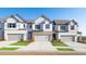 Charming townhomes with stone accents, garages, and manicured lawns create an inviting curb appeal at 4946 Jatoba Rd, Acworth, GA 30101