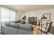 Comfortable living room with a large window, sectional sofa, and modern decor at 4946 Jatoba Rd, Acworth, GA 30101