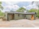 Expansive backyard featuring a freshly painted home exterior and a spacious concrete patio at 525 Rosemont Dr, Decatur, GA 30032