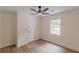 Bright bedroom with a ceiling fan, window and wood-look floors at 525 Rosemont Dr, Decatur, GA 30032