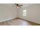 Cozy bedroom with a wood-look floor and natural lighting at 525 Rosemont Dr, Decatur, GA 30032