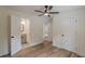 Bedroom with access to two bathrooms, wood floors and ceiling fan at 525 Rosemont Dr, Decatur, GA 30032