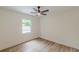 Bright bedroom with a ceiling fan, window and wood-look floors at 525 Rosemont Dr, Decatur, GA 30032