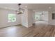 Open concept dining room featuring pendant lighting and wood flooring at 525 Rosemont Dr, Decatur, GA 30032