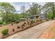 Charming front yard with beautiful, colorful flowers lining the entrance of the exterior of the home at 525 Rosemont Dr, Decatur, GA 30032