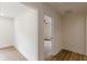 Hallway with wood floors and a glimpse into another room with a ceiling fan at 525 Rosemont Dr, Decatur, GA 30032