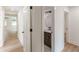 Hallway featuring wood flooring and a bathroom with a modern vanity at 525 Rosemont Dr, Decatur, GA 30032