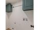 Utility room with hanging rack and overhead storage for convenience at 525 Rosemont Dr, Decatur, GA 30032