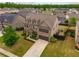 Aerial view of a suburban home with a well-kept lawn and a two-car garage at 590 Birkdale Dr, Fairburn, GA 30213