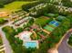 Aerial view showcasing community amenities including pool, playground, sports courts and parking at 590 Birkdale Dr, Fairburn, GA 30213