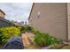 Backyard view of a garden with greenery and wooden walking path at 590 Birkdale Dr, Fairburn, GA 30213