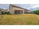 Large backyard with a screened porch and ample green space, perfect for outdoor activities at 590 Birkdale Dr, Fairburn, GA 30213