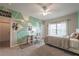 Bright bedroom boasting unique wall decor, neutral carpet, and ample natural light from the window at 590 Birkdale Dr, Fairburn, GA 30213