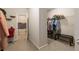 Spacious walk-in closet with ample hanging storage, shelving, and a convenient adjacent laundry room at 590 Birkdale Dr, Fairburn, GA 30213