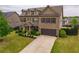 Traditional two-story brick home with landscaped yard and attached two-car garage at 590 Birkdale Dr, Fairburn, GA 30213