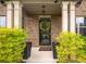 Charming front entrance with a brick facade, complemented by neatly manicured bushes at 590 Birkdale Dr, Fairburn, GA 30213