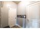 Hallway with neutral paint, and two white doors on either side at 590 Birkdale Dr, Fairburn, GA 30213