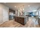 Open concept kitchen with a large island, stainless steel appliances, and views to the living room at 590 Birkdale Dr, Fairburn, GA 30213