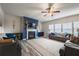 Bright living room with a cozy fireplace, stylish sofas, and large windows with plenty of sunlight at 590 Birkdale Dr, Fairburn, GA 30213
