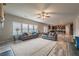 Open-concept living room seamlessly connects to the kitchen, creating an inviting space for Gathering and friends at 590 Birkdale Dr, Fairburn, GA 30213