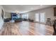 Spacious living room features wood floors and ample natural light from the back windows and doors at 590 Birkdale Dr, Fairburn, GA 30213