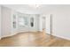 Bright and airy bedroom with large windows, hardwood floors, and neutral decor at 6230 Lillie Lane, Cumming, GA 30040