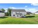 Backyard with a view of the two-story house and surrounding neighborhood at 1109 Blue Juniper Cir, Loganville, GA 30052