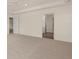 Large bedroom with neutral carpet, a tray ceiling, ceiling fan, and access to the bathroom at 1109 Blue Juniper Cir, Loganville, GA 30052