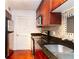Close up view of the kitchen area featuring stainless steel appliances and stylish dark cabinetry at 2657 Lenox Ne Rd # 68 Bld, Atlanta, GA 30324