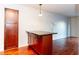 This kitchen is beautifully designed with dark cabinets, black granite countertops and hardwood flooring at 2657 Lenox Ne Rd # 68 Bld, Atlanta, GA 30324