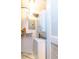 Convenient laundry room features stacked washer and dryer units with shelving for storage at 2657 Lenox Ne Rd # 68 Bld, Atlanta, GA 30324