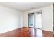 A well lit living room has beautiful hardwood floors, neutral wall color and a sliding glass door to the outside at 2657 Lenox Ne Rd # 68 Bld, Atlanta, GA 30324