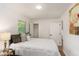 Cozy bedroom featuring natural light, a comfortable bed, and convenient closet space at 3181 Pennington Sw Cir, Atlanta, GA 30354