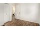 Bright bedroom with wood-look floors, closet, and ensuite access at 3181 Pennington Sw Cir, Atlanta, GA 30354