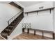 Inviting foyer featuring stairs, a bench with pillows, and convenient shelving at 3181 Pennington Sw Cir, Atlanta, GA 30354