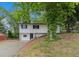 Charming two-story home with a freshly painted white exterior and driveway at 3181 Pennington Sw Cir, Atlanta, GA 30354