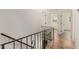 Upstairs hallway featuring hardwood floors, with open bedrooms and natural light at 3181 Pennington Sw Cir, Atlanta, GA 30354