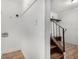 Functional stairway area featuring wall paneling and storage nook under staircase at 3181 Pennington Sw Cir, Atlanta, GA 30354