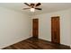 Bedroom featuring hardwood floors and wood doors at 3572 Stone Ridge Trl, Douglasville, GA 30134