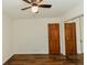 Bedroom featuring hardwood floors and mirrored closet doors at 3572 Stone Ridge Trl, Douglasville, GA 30134