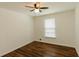 Bright bedroom featuring hardwood floors and a ceiling fan at 3572 Stone Ridge Trl, Douglasville, GA 30134