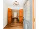 Inviting entryway featuring hardwood floors and a stylish light fixture at 3572 Stone Ridge Trl, Douglasville, GA 30134