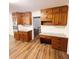 Eat-in kitchen featuring wood cabinets, granite countertops, and stainless steel appliances at 3572 Stone Ridge Trl, Douglasville, GA 30134
