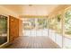 Inviting screened porch with wood flooring and a view of the backyard at 3572 Stone Ridge Trl, Douglasville, GA 30134